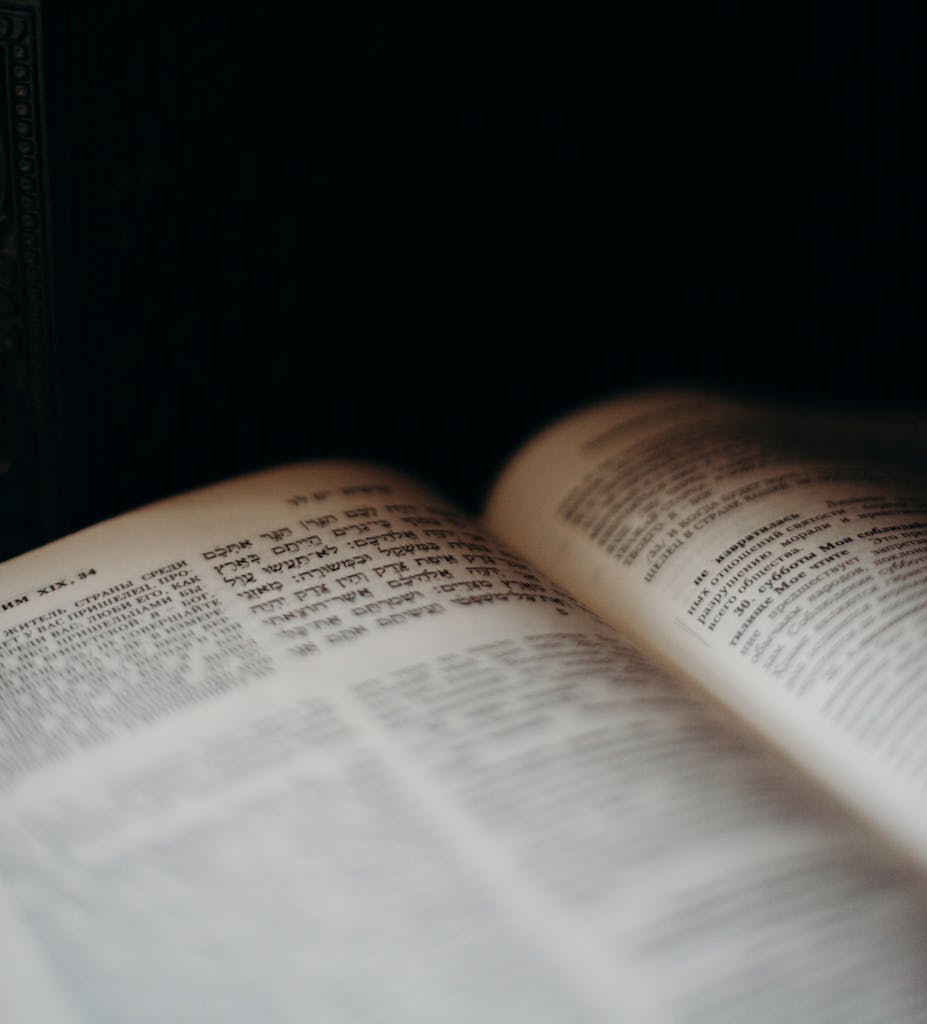 A close-up of an open book with Hebrew text, symbolizing Jewish tradition and values.
